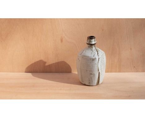 ARR David Leach (1911-2005) a stoneware bottle of square form glazed in oatmeal on brown with an abstract tree resist design,
