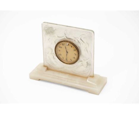 A glass and onyx mantel timepiece in the manner of Lalique, the eight-day Swiss movement set in a moulded case decorated with