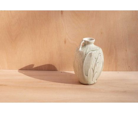 ARR Mike Dodd (born 1943) a celadon glazed flagon with incised stylised leaf design, 24cm highCrazing to the glaze from firin