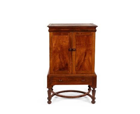 ARR Jeremy Green (born 1951) an Arts & Crafts style drinks cabinet, the two cupboard doors above a single drawer base, on sha
