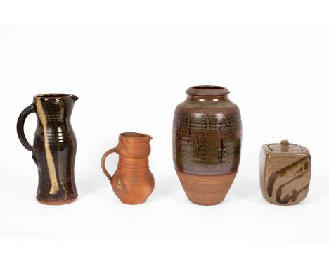 A Winchcombe Pottery treacle glaze vase, impressed seal mark, 34cm high, a studio pottery jug with dark brown and green glaze