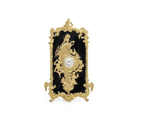 A 19th Century French gilt ormolu and coromandel desk time piece of Rococco designThe Rococo inspired case of asymmetrical de