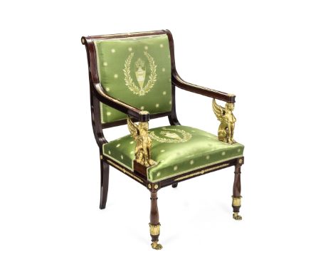 A French 19th century Empire revival gilt bronze mounted fauteuilWith a dished and scrolled back, the frames mounted with lau