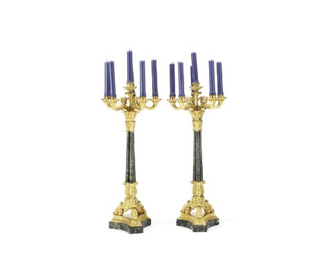 A pair of 19th century French gilt bronze and verdi antico six light garniture candelabrathe five reeded scrolling arms with 