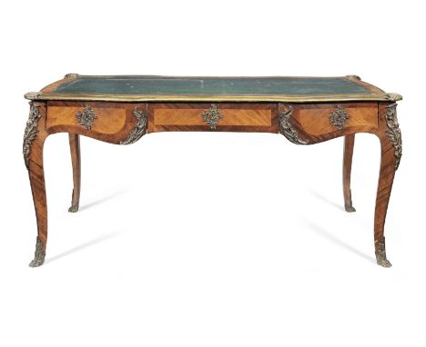 A French late 19th century gilt bronze mounted rosewood and bois satine bureau platin the Louis XV styleThe shaped top inset 