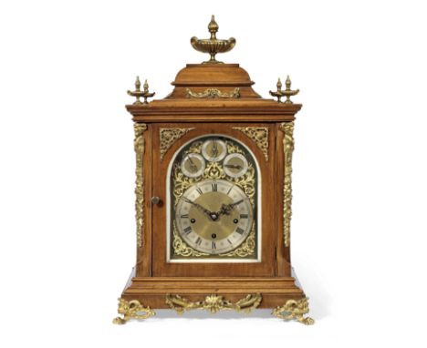 A late 19th century German gilt metal mounted mahogany quarter chiming table clockPeerless, number 99798surmounted by ribbed 