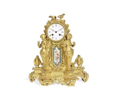 A late 19th century French gilt bronze figural and Sevres style porcelain inset mantel clockin the Louis XVI tastethe arched 