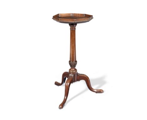 A George III mahogany kettle standCirca 1770, the galleried octagonal top above a concealed slide, on a ring turned and spira