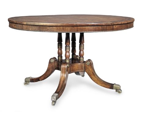 A Regency brass mounted and brass inlaid rosewood breakfast tableCirca 1820, the tilt-top inlaid with a stylised foliate bord