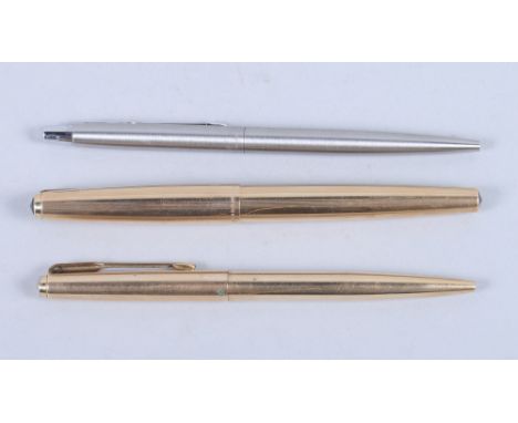 A gold plated Parker 61 fountain pen, with matching rollerball, and a similar stainless steel rollerball