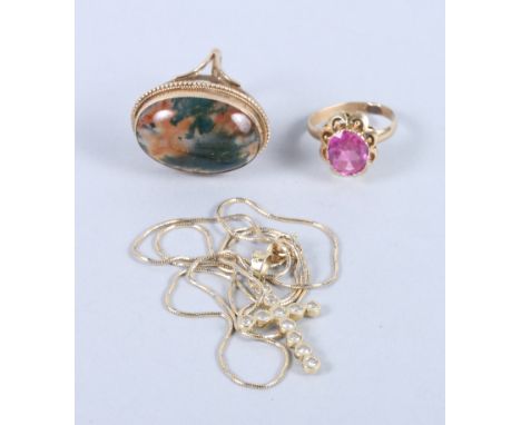 A 9ct gold and moss agate ring, an 18ct gold dress ring set pink stone, and a 14ct gold crucifix set cubic zirconia on a 14ct