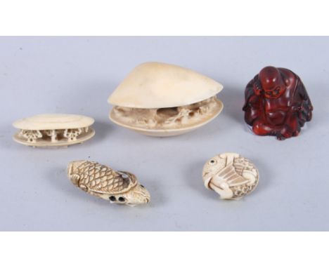 An okimono, formed as a shell with figures, 3" wide, a smaller similar okimono, two fish netsuke and a seated Buddha okimono