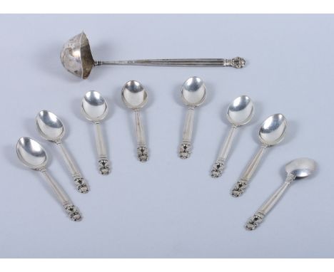 A set of eight Georg Jensen teaspoons and a matching twin lipped ladle of the "Acorn" design by Johan Rohde, fully marked, la