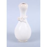 An Oriental style pottery, cream glazed gourd vase with applied dragon decoration, unmarked