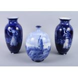 A pair of Doulton Burslem "Morrisian" blue and white figure decorated vases, 8 1/2" high, and a