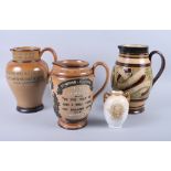 A Doulton Lambeth tube lined "William Ewart Gladstone" jug, 9 1/4" high, a similar jug "Benjamin