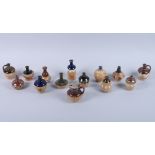 A collection of twelve Doulton Lambeth miniature stoneware sprig decorated vases, various designs,