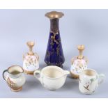 A pair of Doulton Burslem bone china floral decorated two-handled vases, 6 1/4" high, a Doulton