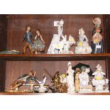 A Lladro porcelain figure of a girl with a doll, a Japanese flower arranger, a girl with a pram, a