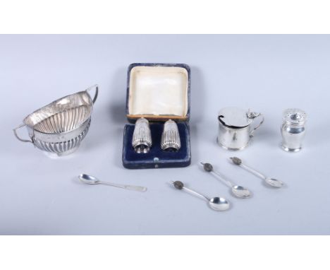 A quantity of silver, including a two handled sugar basin, a pair of pepperettes, etc, 7.9oz troy approx