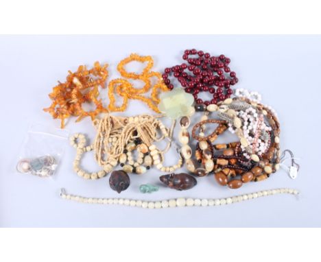 A Chinese jade pendant, formed as a star, together with various necklaces 