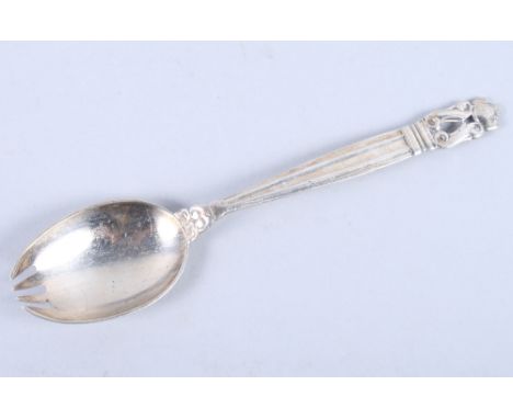 A Georg Jensen "Acorn" pattern silver pickle spoon/fork, 6" long