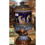 An early 20th Century Doulton Lambeth stoneware water filter with classical figure and moulded