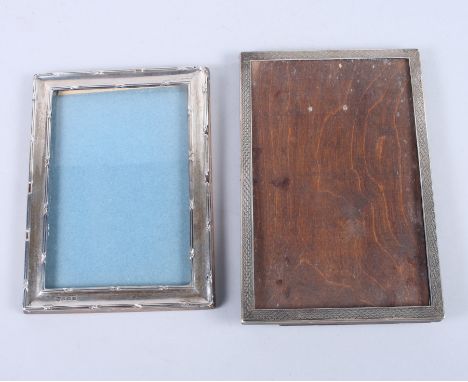 A silver photo frame with engine turned decoration and one other (lacking back)