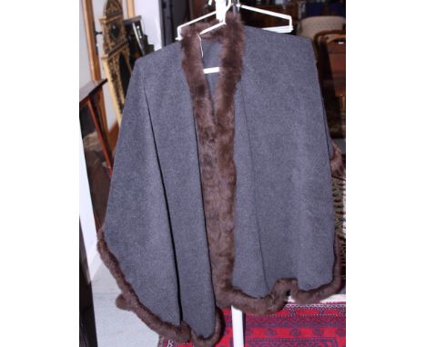 A fur trimmed woollen cloak