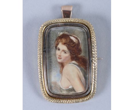 A Georgian yellow metal mounted portrait brooch of a woman, in the style of Joshua Reynolds