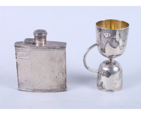 A George V silver hip flask with engine turned decoration, 3 3/4" long, and a George V silver double ended shot measure, 5.8o