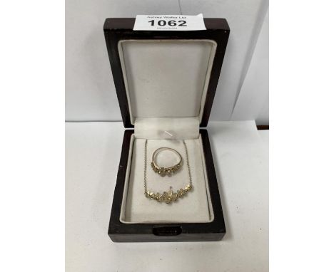 A SILVER FLORAL NECKLACE TOGETHER WITH MATCHING RING 