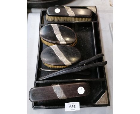 A VINTAGE EBONY AND SILVER BACKED DRESSING TABLE SET 