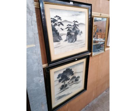 TWO ORIENTAL PRINTS IN EBONISED FRAMES 
