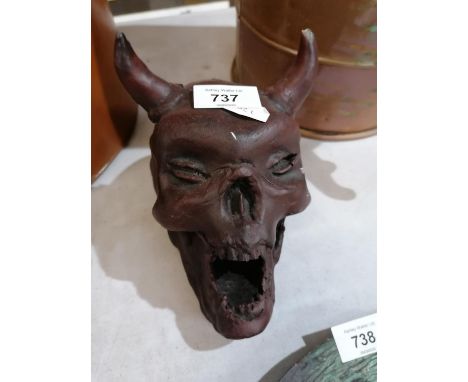 A CAST SKULL WITH HORNS MODEL 