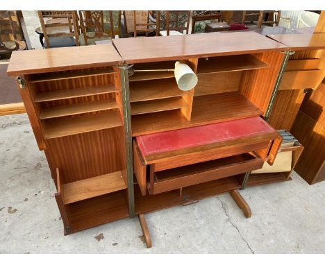 A NEWCRAFT "HOME OFFICE" RETRO TEAK DESK WITH FOLD OUT SIDE CUPBOARDS, RETRACTABLE WRITING SURFACE AND RETRO LAMP 