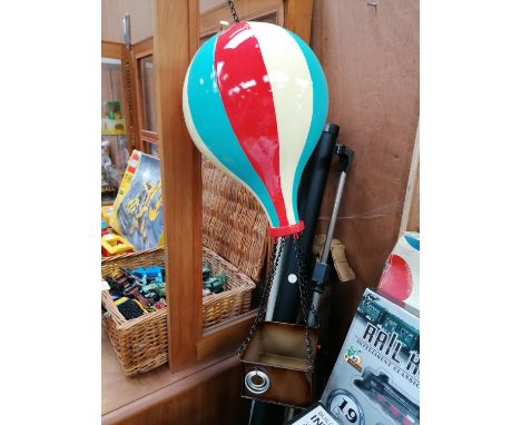 A VINTAGE STYLE TIN PLATE MODEL OF A HOT AIR BALLOON 