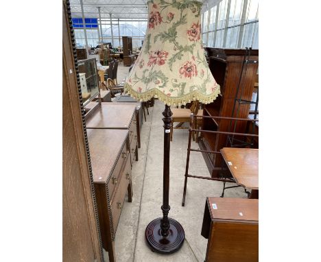 A MAHOGANY STANDARD LAMP 