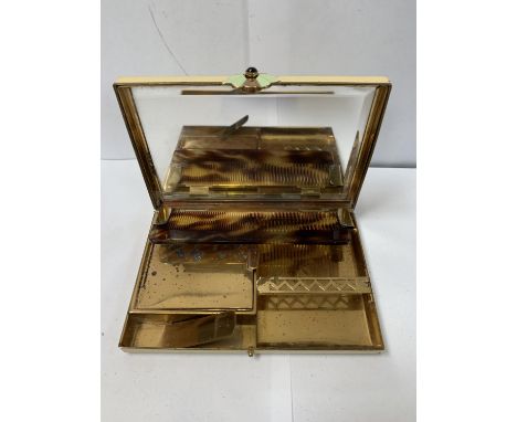 AN ART DECO COMPACT WITH MIRROR, COMB ETC 