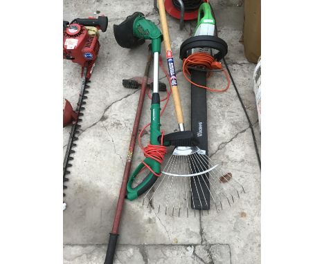 A VIKING HE600 ELECTRIC HEDGE CUTTER, A RAKE POGO STICK AND A GARDEN LINE STRIMMER IN WORKING ORDER 