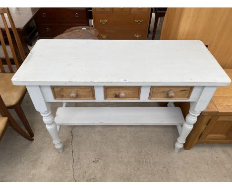 A WHITE AND PINE SIDE TABLE WITH THREE DRAWERS AND LOWER SHELF 