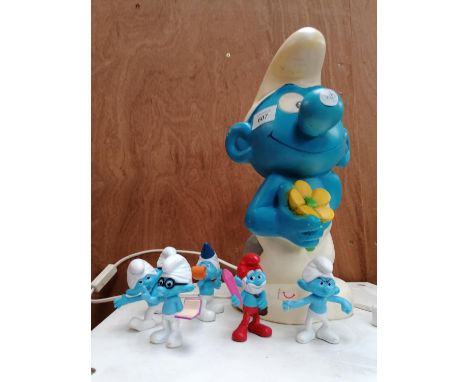 A COLLECTION OF SMURF FIGURES AND WORKING ORDER SMURF LAMP 