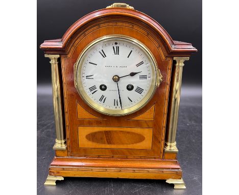 Two train mahogany inlaid French mantle clock. Retailed by Mappin and Webb, Oxford Street. 26cm h. Brass carrying handle, fee