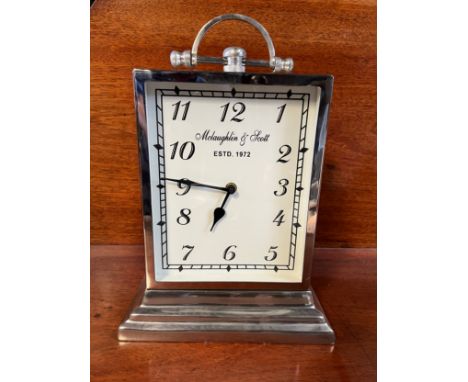 McLaughlin and Scott chrome battery operated mantle clock. 38cm h.Condition ReportGood condition.