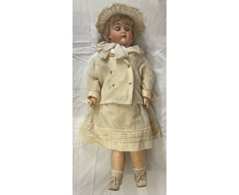 A early 20th Century Max Handwerck Germany 9 1/2 bisque socket head doll, with blue glass sleeping eyes, open mouth with teet
