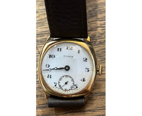 A Cyma gentleman's 9ct gold wristwatch with white enamel face and subsidiary second dial on leather strap.Condition ReportWin