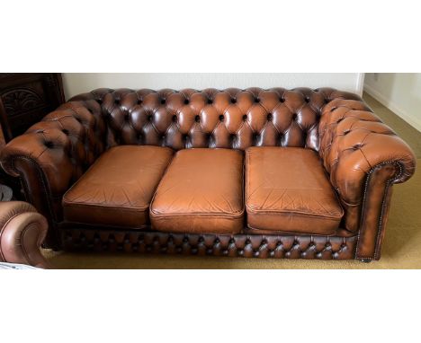 A brown leather button backed sofa 187 l x 87cm d.Condition ReportOne cushion a/f.