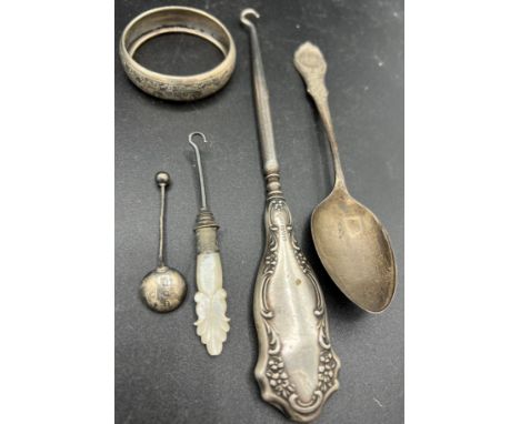 Silver to include spoons, napkin ring, button hook and plated and mother of pearl button hook.