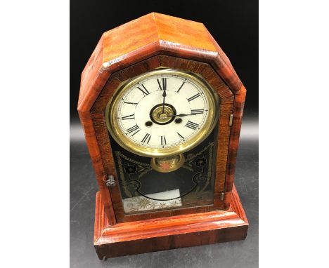 Mahogany mantle clock 36 h x 25.5 w x 11.5cm d. Made my New Haven Clock Co, New Haven, Connecticut, USA.Condition ReportOuter