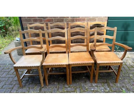 Eight Acorn Man wavy ladder back dining chairs to include 2 carvers, all with leather seats. Condition ReportSlightly sun ble